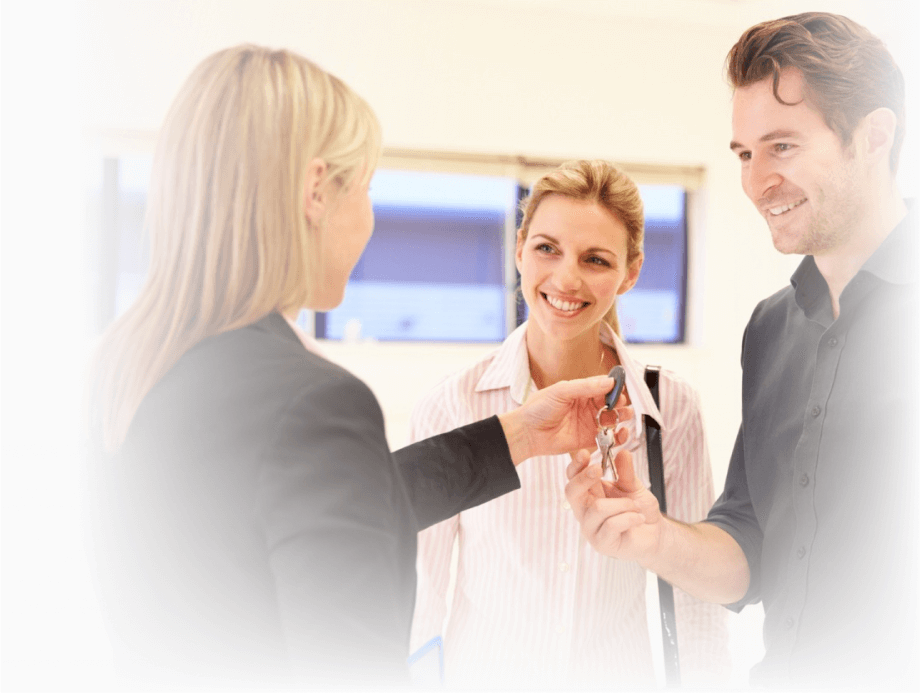 people taking keys to new apartment